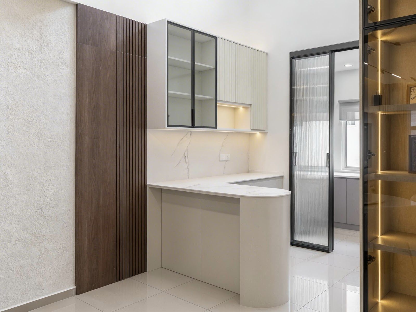 Pantry with fluted panel and glass cabinets